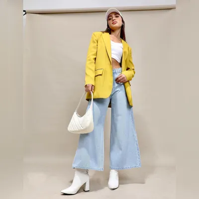 A chic and modern way to style denim. I paired wide-leg jeans with a white crop top and a bold yellow blazer, finished with white boots and a cap for a fresh, street-style-inspired look.