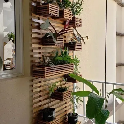 This custom-made, space-saving planter stand is crafted from solid pinewood. Its vertical design is perfect for balconies, allowing you to display a wide variety of plants without taking up valuable floor space.