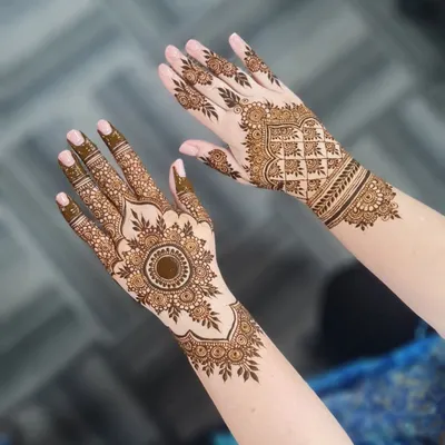 The definition of beauty. This design features a stunning central mandala on one hand and a geometric cuff on the other.