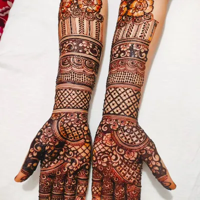 A stunning full-arm design for a beautiful bride. We combined traditional bands, delicate netting, and floral patterns for a classic and elegant bridal look.