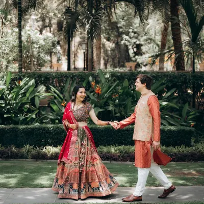 A candid, walking shot of the couple in the beautiful gardens of the ITC Maratha. I love capturing these natural, in-between moments.