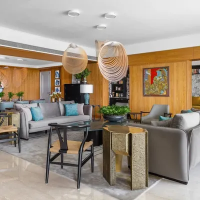 The Magnolia project is a curated experience where every object tells a story. This open-plan living and dining area balances function and beauty, from the inviting sofas and armchairs to the artistic coffee tables from my Koko collection. The magnificent chandelier and elegant dining setting complete the narrative.