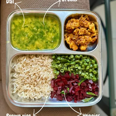 I used to hate vegetables as a child, but now they are a core part of my diet. This plate with brown rice, dal, greens, and veggies shows how my understanding of balanced meals has evolved. Indian food offers incredible variety for a plant-based diet.