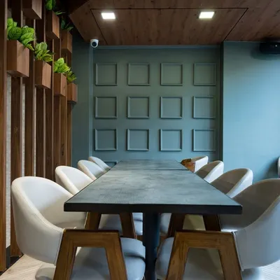 A carefully composed photograph of a private dining area within a modern cafe. We use leading lines and balanced composition to create a sense of order and aesthetic appeal, making the space look attractive for group bookings.