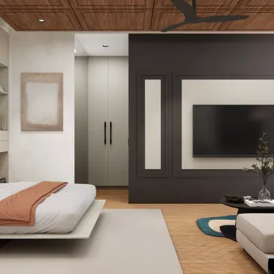 This space was transformed from a family room into a smartly designed bedroom. A sleek Murphy bed tucks away when not in use, while a low couch and mounted TV create a soft divide between lounging and sleeping zones, showcasing a perfect multi-functional design.
