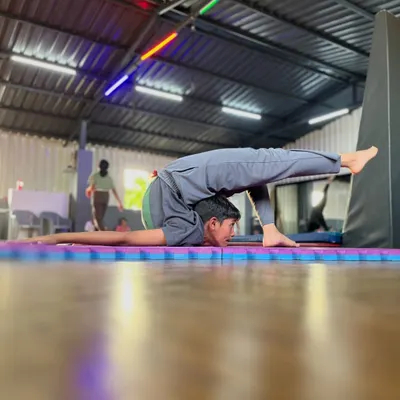 Defying gravity and expectations. This incredible pose showcases the amazing strength and flexibility of a true contortionist. We help you reach for the extraordinary.