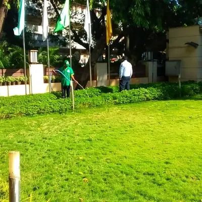 Maintaining a healthy, green lawn is a key part of my landscape services. Here, my team is treating the grounds of a large property to ensure the grass stays lush and vibrant, which is essential for a professional appearance.
