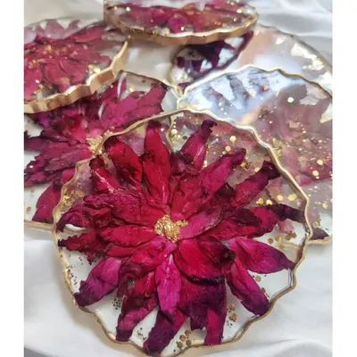 Capturing everlasting love in a set of custom floral coasters. These pieces are made with real preserved flowers and edged with gold, making them a beautiful and functional addition to any home.