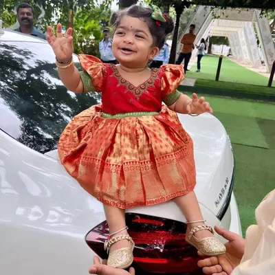 There is nothing more special than creating a tiny outfit from a mother's saree. I designed this adorable silk frock for a little princess, complete with puffed sleeves and using the rich brocade for the skirt.
