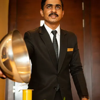 In-room dining served with a smile at the Courtyard by Marriott. This shot captures the essence of Indian hospitality, combining great food with warm service.