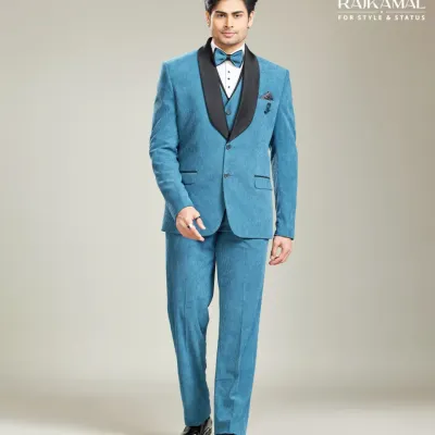 A full view of a modern three-piece suit in a vibrant blue. The black shawl collar adds a touch of classic tuxedo styling, making it a versatile choice for cocktail parties and receptions.