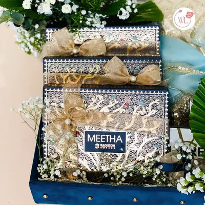 For the most important gifts exchanged between families, I design bespoke trousseau packaging. This royal blue velvet case with its ornate interior boxes is created to be a symbol of love and the formation of a new bond.