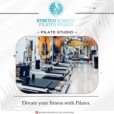 A wide view of our clean and modern studio, fully equipped with reformers and ready for our anniversary celebration. This is where you'll elevate your fitness.