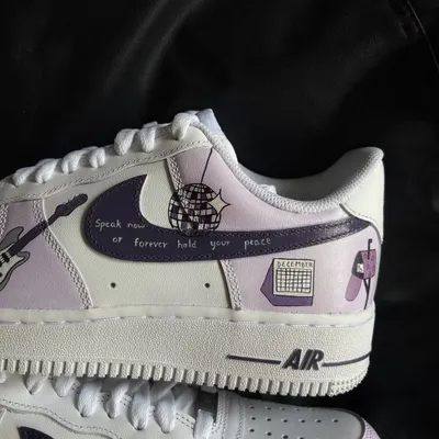 A close-up of the "Speak Now" Taylor Swift custom Nike Air Force 1, featuring lyrics and a disco ball design.