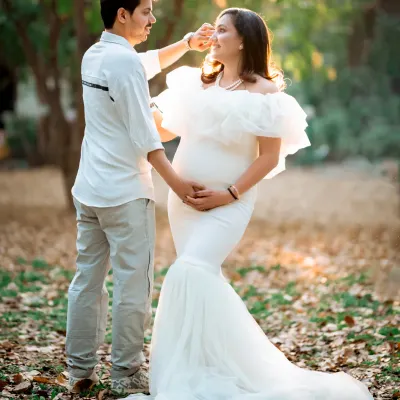 A quiet moment of connection between the soon-to-be parents, captured in the soft, warm light of a park. I love how nature provides the most beautiful backdrop for these candid pregnancy portraits.