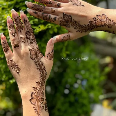 This bespoke butterfly design is a client favorite for its modern and whimsical feel. The delicate vines and scattered hearts add a touch of romance, perfect for an engagement or special party.