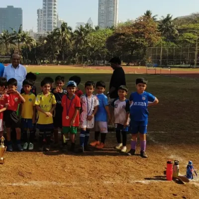 A team of our youngest players proudly stands with their medals after competing in the PDP Next Gen Football Tournament. We believe in celebrating participation and effort at every age.