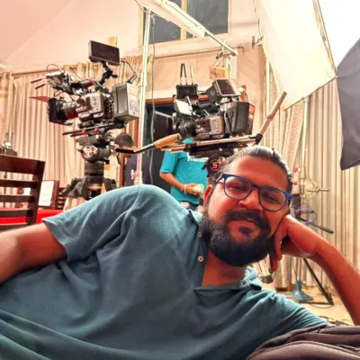 Taking a quick break on set. This behind-the-scenes shot shows the professional cinema cameras and lighting equipment we use for high-end video production.