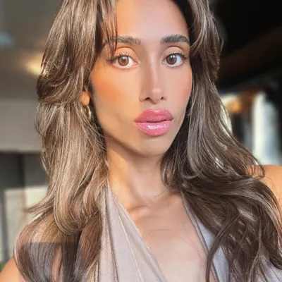 This client selfie says it all. She is radiating confidence with her new voluminous, layered hair extensions that give her a glamorous, photo-ready look anytime.