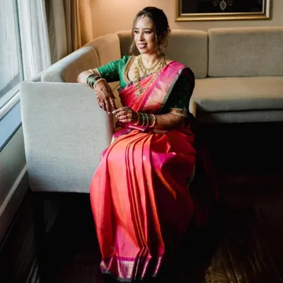 The quintessential Maharashtrian bridal look. This bride is glowing in her pink and orange Paithani saree, which I pre-pleated to highlight its rich colors and traditional design.
