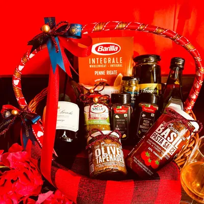 My 'An Italian Romance' hamper is perfect for a cozy night in. This basket includes Barilla pasta, basil pasta sauce, olive tapenade, wine, and seasonings for a complete Italian meal experience.