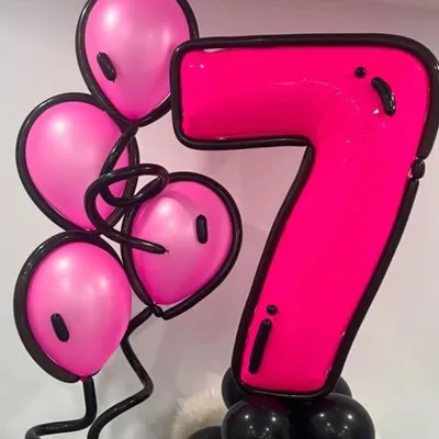 We love this cartoon-style balloon structure. The bold pink number "7" and matching balloons have a cool 2D-effect outline, making it a super fun and trendy decoration for a birthday party.