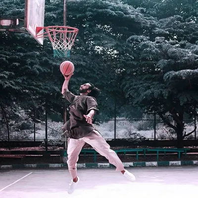 When I'm not lifting, I'm on the court. This creative shot combines my love for basketball with a bit of traditional flair.