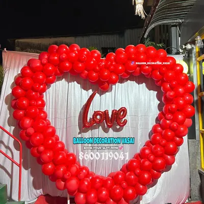 This giant heart-shaped arch made of red balloons is perfect for anniversaries, Valentine's Day, or any celebration of love. It creates a bold and romantic photo opportunity.