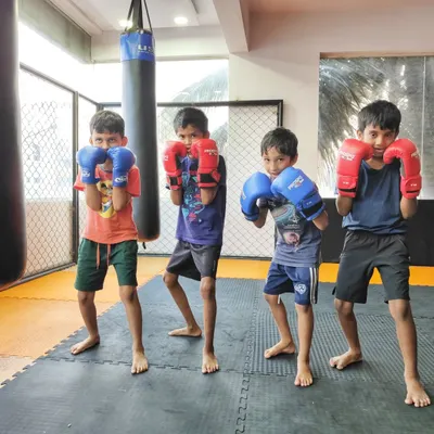 Our young fighters getting ready for some kickboxing drills. We teach them proper stance and guard in a way that feels like a fun game, not a boring lesson.