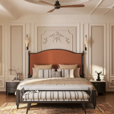 This master bedroom is a study in neoclassical elegance. We used classic wall moldings, a timeless two-poster bed with a rich rust-orange headboard, and a balanced, neutral palette to create a sanctuary that feels both grand and deeply restful.