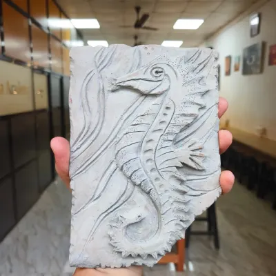This incredible seahorse fossil mural, created by one of our students, looks like an artifact dug from the earth. The class focused on creating deep textures and intricate details to achieve a realistic, time-worn effect.