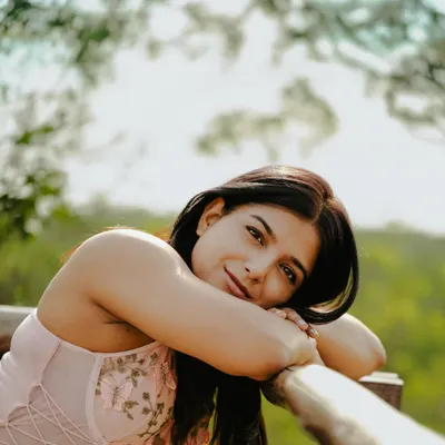 This dreamy, soft-focus portrait was shot outdoors to create a gentle and approachable feel. It's perfect for a creative professional or anyone looking for a personal branding image that feels warm and authentic.