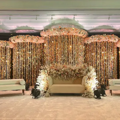 This reception stage demonstrates how I use texture and light to create a luxurious focal point. Cascading crystal strings and floral clouds produce a shimmering, three-dimensional effect that looks stunning both in person and on camera for any corporate gala.