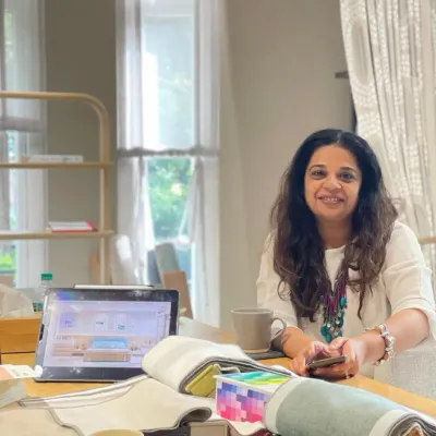 This is me in my element, surrounded by fabric samples, color palettes, and design plans. With over 18 years of experience, I've had the privilege of transforming more than 300 spaces, but my passion for creating comfort and emotion in every corner remains the same.