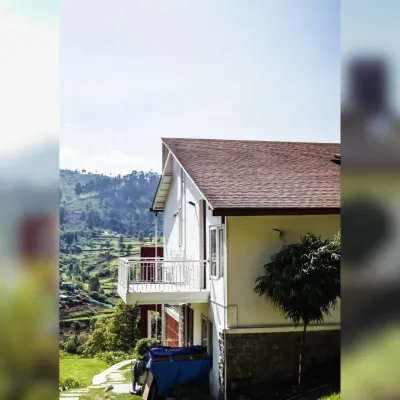 A view of the Raghunath Farmhouse, showing how the split-level design follows the natural slope of the hill. This approach allowed us to minimize excavation and create a home that blends quietly into its surroundings.