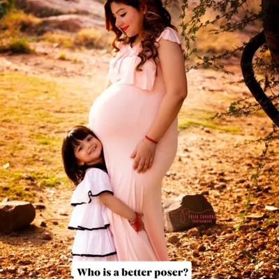 Who is the better poser? It's always so much fun when older siblings join the maternity shoot. This little one is already a natural in front of the camera.