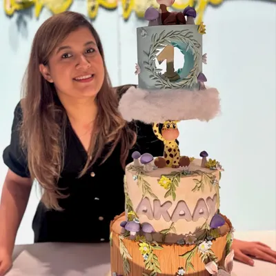 So proud of how this whimsical forest cake turned out. It combines structural work with detailed fondant characters like the giraffe and deer.