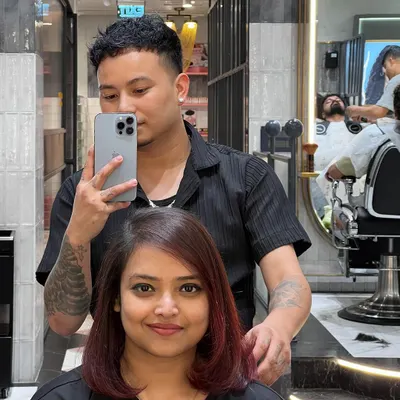 Everything feels better after a fresh hair color and cut. This client is rocking her new chic bob with a subtle reddish tint.