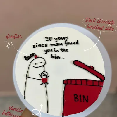 A funny and relatable cake for a sibling. This design features a Flork meme doodle with the text "20 years since mom found you in the bin," made on a dark chocolate hazelnut cake.