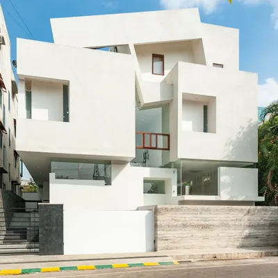 stacked… the neeti residence exterior, where interlocking blocks define the building's massing.