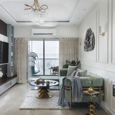 An overview of the 'Urban Vista' living room, where a custom teal L-shaped sofa, gold accents, and a large-format clock come together to create a cohesive and inviting environment with a touch of opulence.