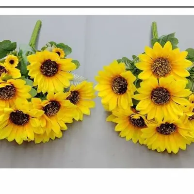 Bright and cheerful artificial sunflower bunches, perfect for creating vibrant floral arrangements for events or home decor.