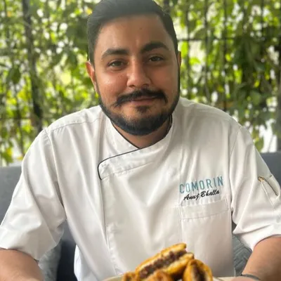 A portrait of our Head Chef at Comorin Gurugram, Anuj Bhalla. He leads our kitchen team with a passion for flavour and a commitment to quality that defines every plate we serve.