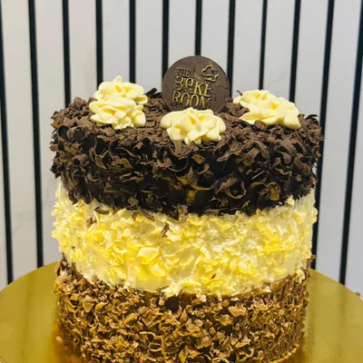 My signature Triple Chocolate 24 Heaven Pastry. This cake has 24 layers of dark, milk, and white chocolate sponge and mousse, creating a truly heavenly experience for chocolate lovers.