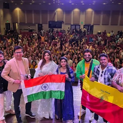 A proud moment with my band and the Indian and Kannada flags after a successful show in America. It is an honor to represent our culture on a global stage.