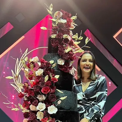 This is me, Neeth, with one of my proudest creations. From architect to patissier, my passion is creating stunning cakes that taste as good as they look.