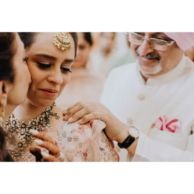 A daughter's tears and a father's comfort. This incredibly tender moment between the bride and her parents is a powerful reminder of the love that shapes us.