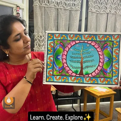 Here I am with a finished Madhubani painting, a style known for its intricate geometric patterns and themes from nature and mythology.