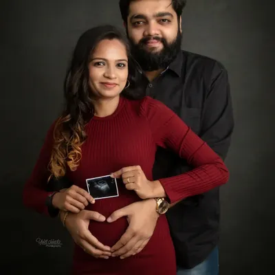 The very first picture. Holding up your sonogram is a simple yet powerful way to announce your pregnancy. This is the beginning of a beautiful new chapter.