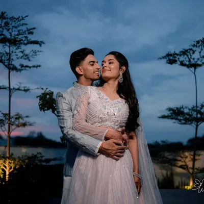 A perfect couple shoot against a beautiful Bangalore sunset. The minimal decor and pastel hues of their outfits created a soft, romantic setting for these stunning Roka ceremony portraits.